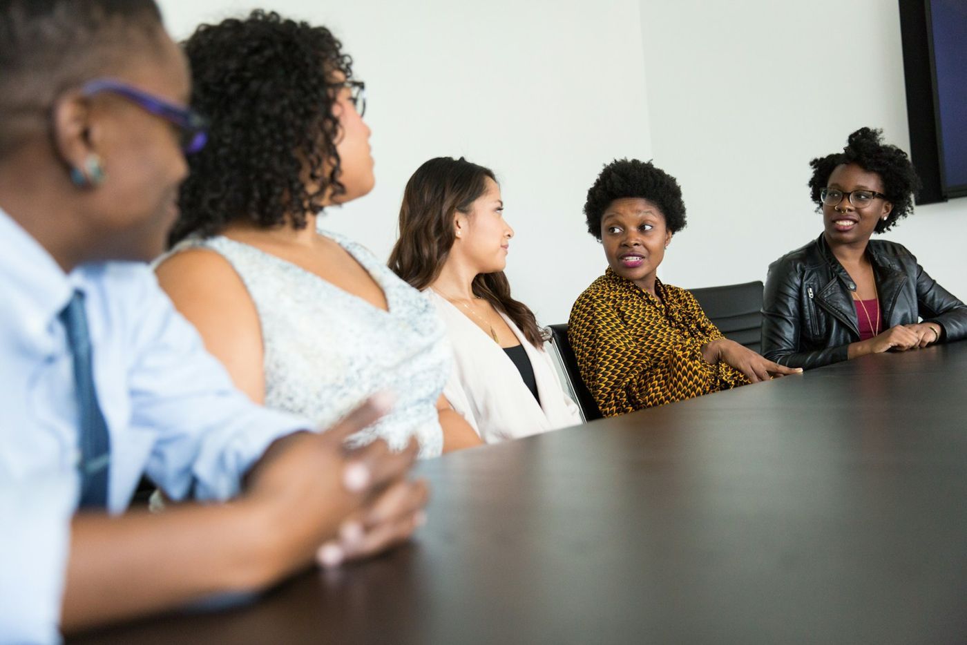 A team in discussion around a meeting table