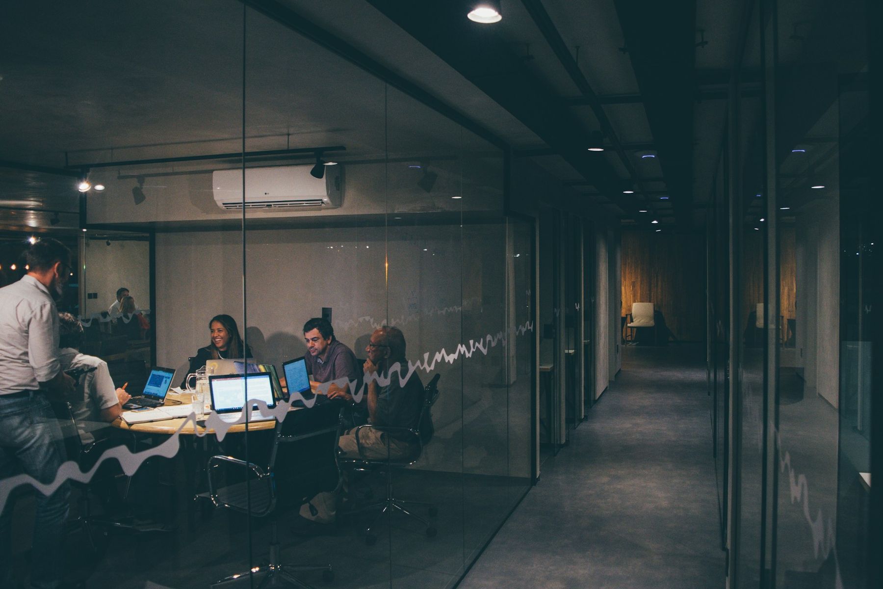A team meeting around a table in a modern office